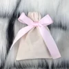 Beige Bag with Light Pink Ribbon