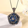 Black gold Blue pointed crystal pendant with chain