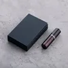 Black perfume spray bottle with black box
