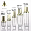 Flacon de lotion dorée de 20 ml en verre transparent