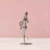 Reed pipe-iron art figurine