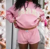 Pink, yellow letters with white edge