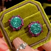 Black gold parrot green stud earrings