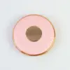 round pink mirror