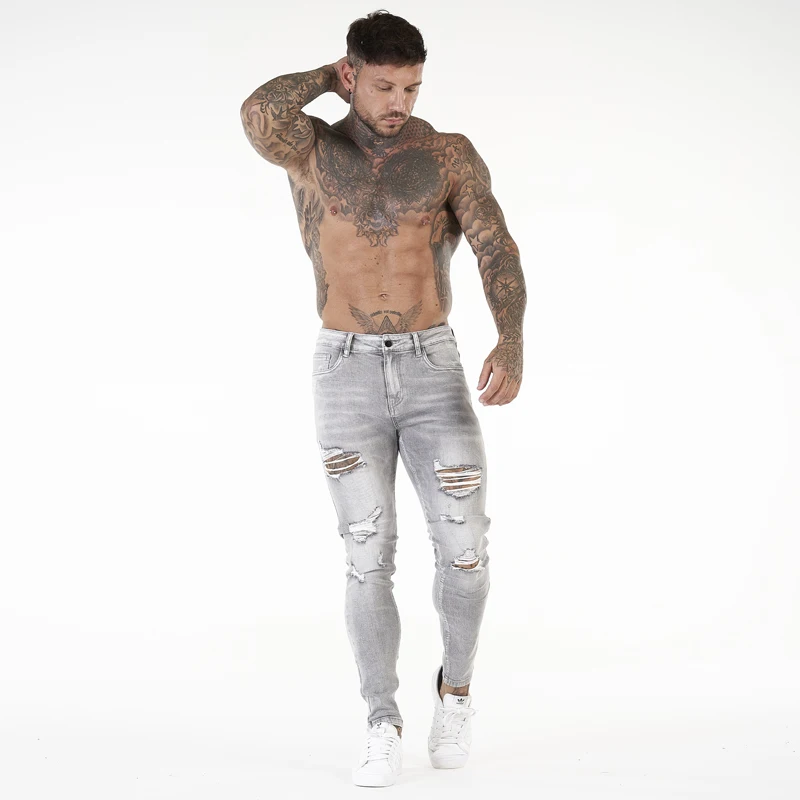 Etichette private personalizzate, alla moda, taglie forti, jeans strappati attillati da uomo, pantaloni in denim consumato_voghion.com