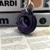 Llavero Cabeza de Dragón - Seda Negra y Morada