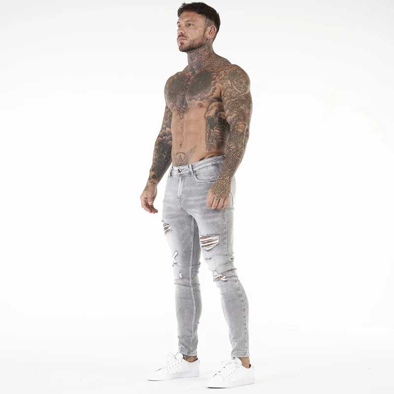 Etichette private personalizzate, alla moda, taglie forti, jeans strappati attillati da uomo, pantaloni in denim consumato_voghion.com