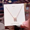 Oro rosa con incastonatura a diamante a forma di H