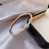 19 bracciale-oro rosa-acciaio al titanio