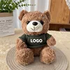 Orsetto di peluche marrone - maglione verde scuro