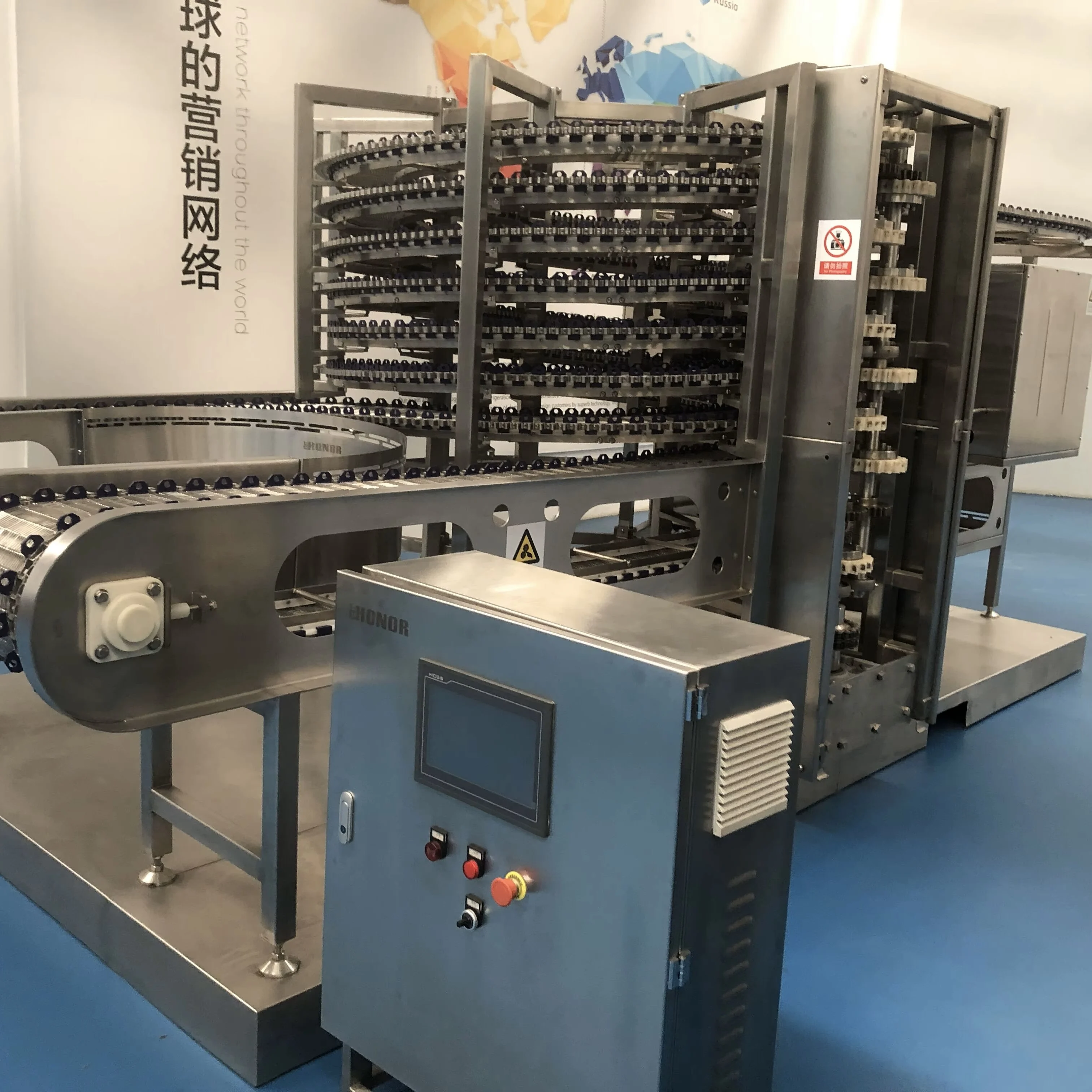 High-efficiency spiral freezers for meat, seafood and prepared food processing lines