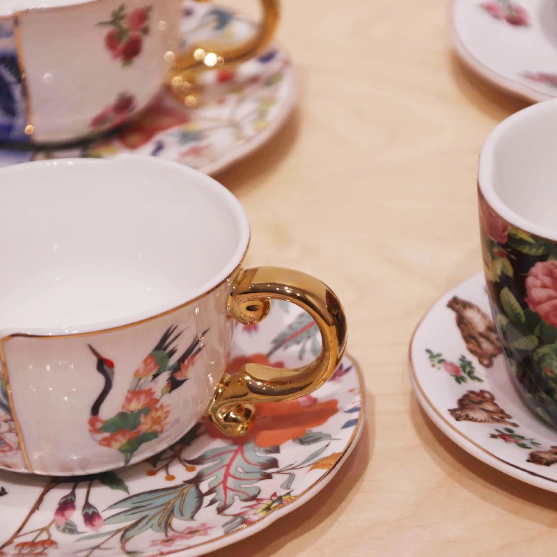 Unique Design Eco Friendly Hybrid Shape Fancy Luxury Ceramic Coffee Tea Cup and Saucer Set With Golden Handle supplier