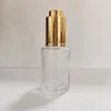 Clear with gold dropper