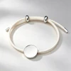 Cordoncino color crema + ciondolo in argento