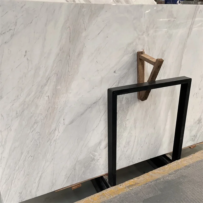 แผ่นหินอ่อนสีขาวโวลากาส์คุณภาพสูงยอดนิยม ราคาแผ่นหินอ่อนโวลากาส์ กระเบื้องหินอ่อนโวลากาส์สำหรับโครงการปูพื้นภายในอาคาร