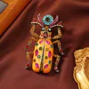 colorful Orange Egyptian scarab brooch