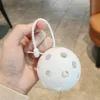 White molded ball with adhesive buckle