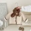 Veste en coton marron double face avec cache-cou.