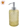 Yellow glass bottle with matte lotion pump
