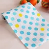 White background with blue polka dots