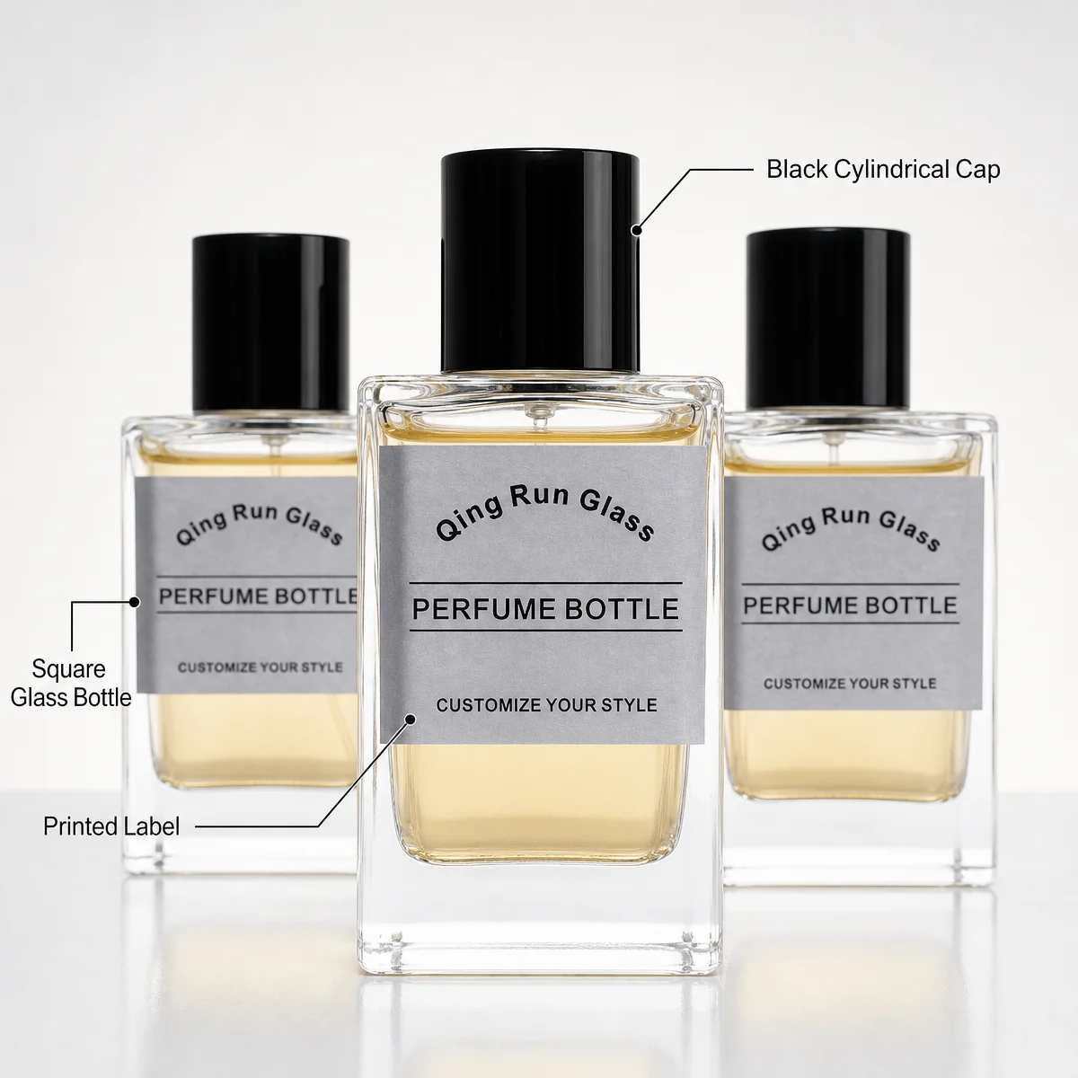 Clear Square Glass Perfume Bottles with Black Cylindrical Caps and Printed Labels