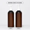 Matte brown bottle with white lotion pump