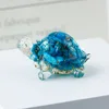 51 lake blue shell + gold foil
