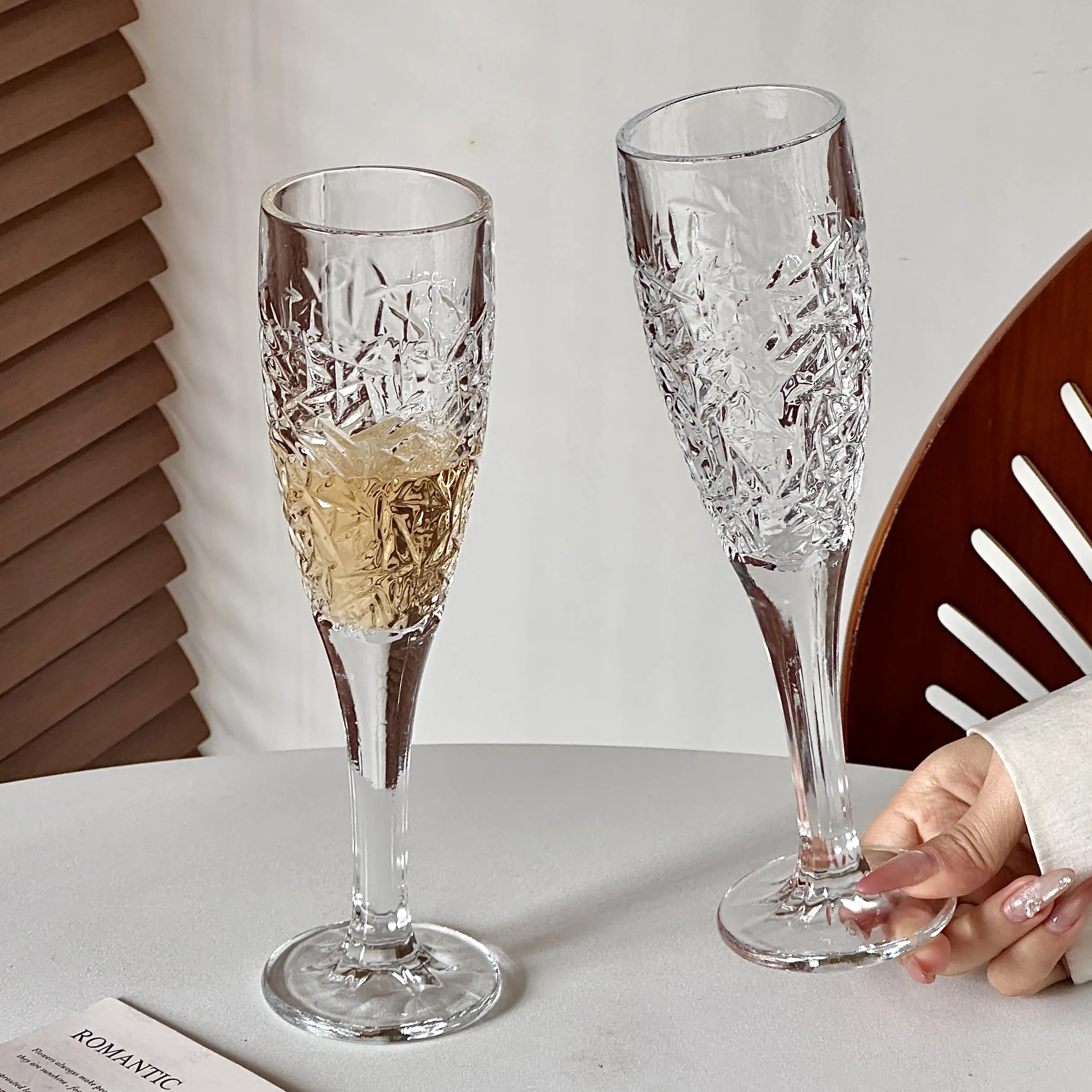 Champagne flutes with textured bowls and long stems