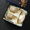 Confezione regalo 2 tazze 2 piatti e 2 cucchiai (Oro)