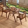 Walnut-colored table and chair balcony set
