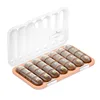 28-compartment pillbox [transparent brown with English labeling]