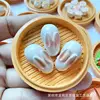 - A jade rabbit bag in a cage