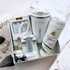 Taza termo, soporte para teléfono móvil, cable de datos, paraguas.