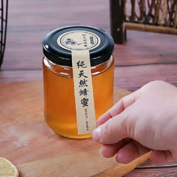 Factory Produced Food Grade Empty Clear Round Glass Honey Jar manufacture