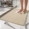 Beige shower mat with edging