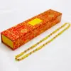 Collana cilindrica in oro con scatola