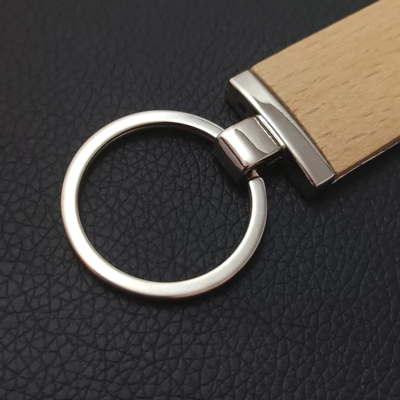 
Уникальный новый дизайн, брелок для ключей из высокополированного металлического сплава, оптовая продажа, лазерный логотип на заказ, пустая реклама, брелок из Букового дерева 