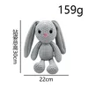 Knitted gray female rabbit
