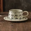 Small fish-shaped earthenware cups and saucers