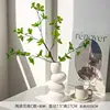 Vase en galets avec crin de cheval