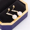 Boucles d'oreilles pendantes en or massif 10 carats.