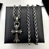 Cross with alphabet chain