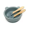 Ciotola in silicone a forma di orso, colore blu mare, con manico in legno e cucchiaio.