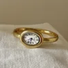 Oro con quadrante bianco