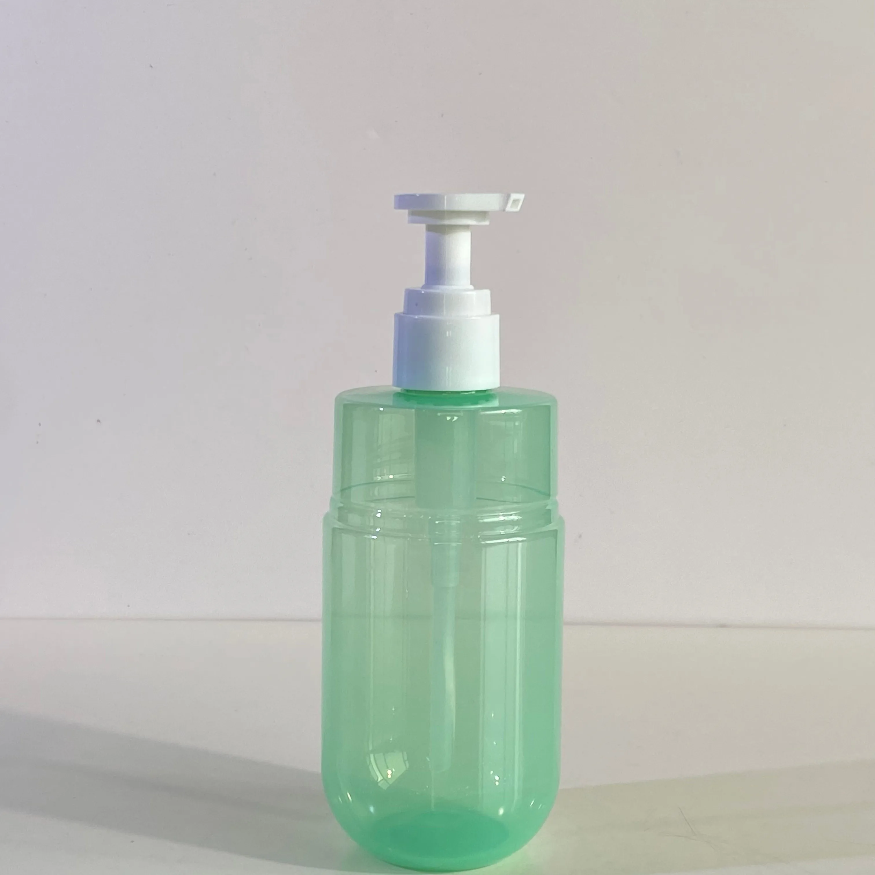 300ml Capacity Transparent Green PET Pump Dispenser Bottle for Cosmetic Lotion with Custom Logo