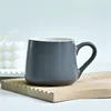 Matte dark gray wide-bellied cup
