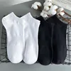 Black and white corsets and black boat stockings