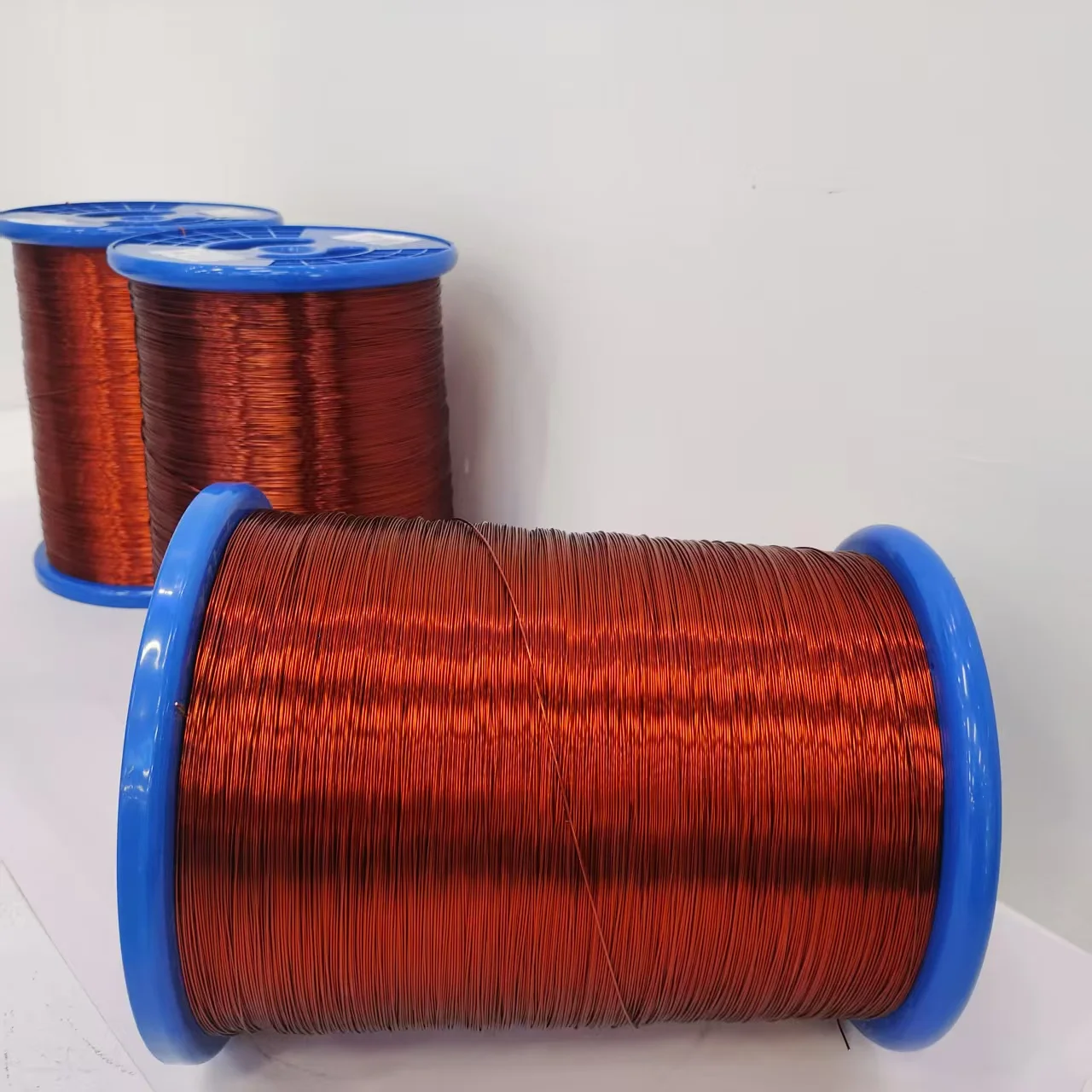 Huaerda EIW 0.600mm 180℃ ເຊືອກແບບແຂງ polyesterimide enamel ທີ່ສາມາດເຊື່ອມໂດຍກົງໄດ້ ເຊືອກໄຟຟ້າສຳລັບມື້ນທີ່ຄວາມຖີ່ສູງ