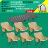 A black 120mm long table with six khaki low moon chairs.