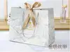 White cardboard; 067 gold ribbon; Trumpet 18.16.10